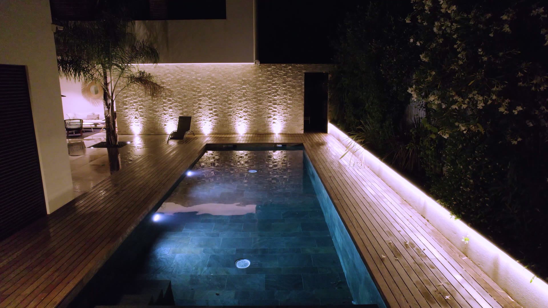 Reef Pools and Spas process — slow aerial rise over a private pool